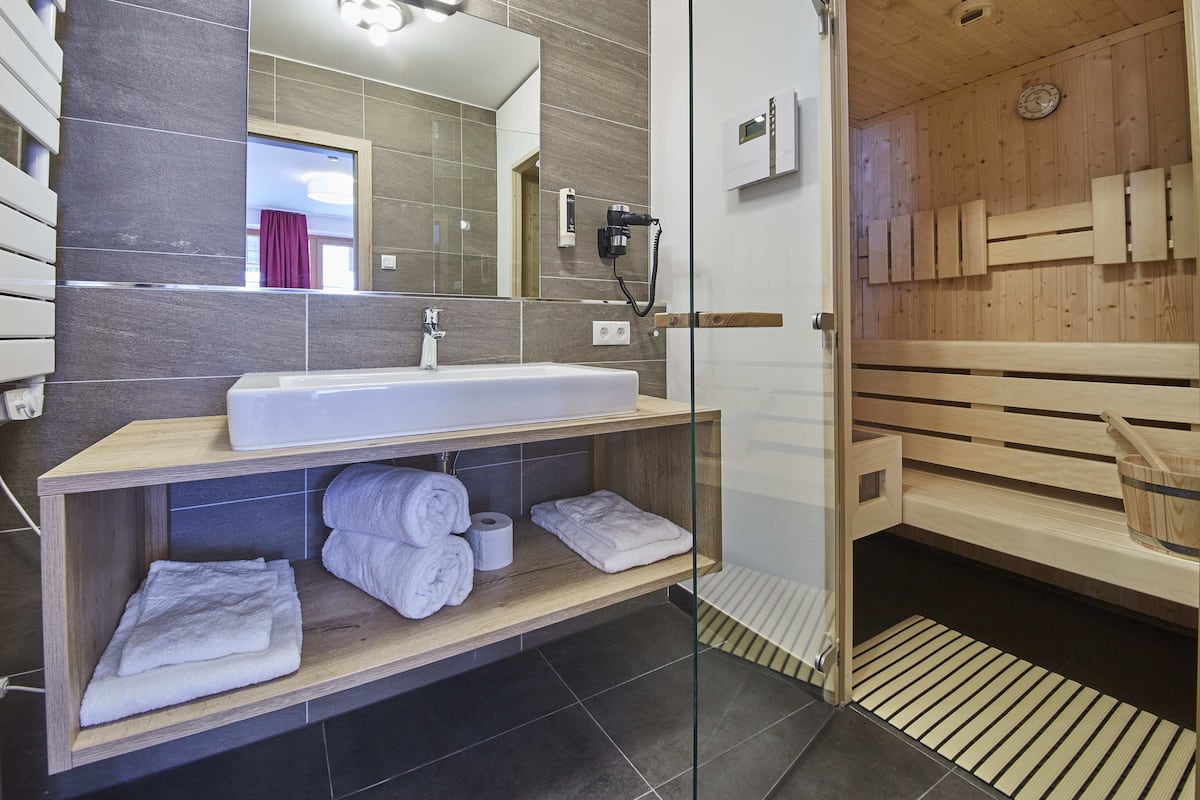 studio alpine spa | bathroom | shower, hair dryer, bathrobes, towels