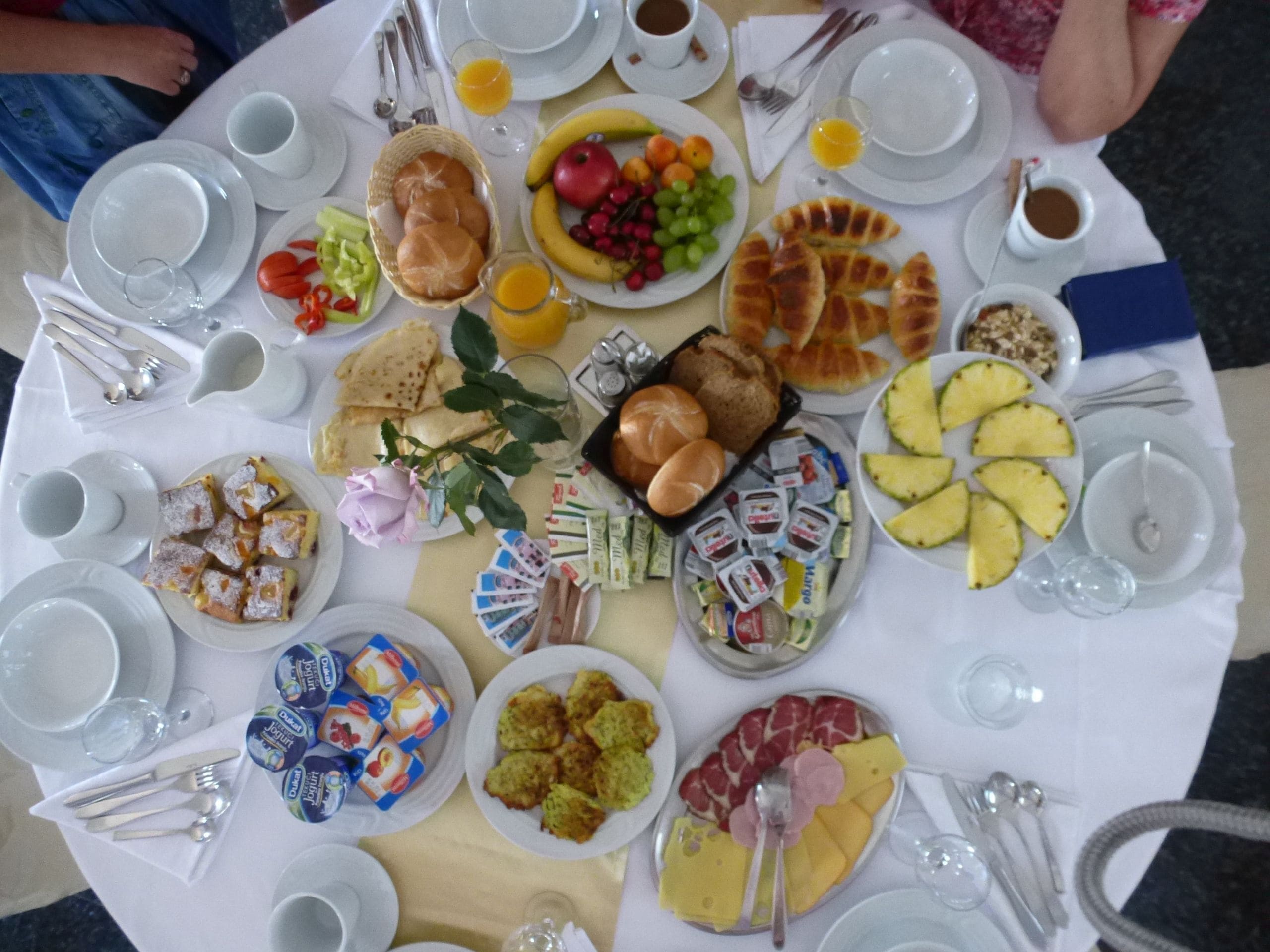 A breakfast buffet with various food items and beverages.