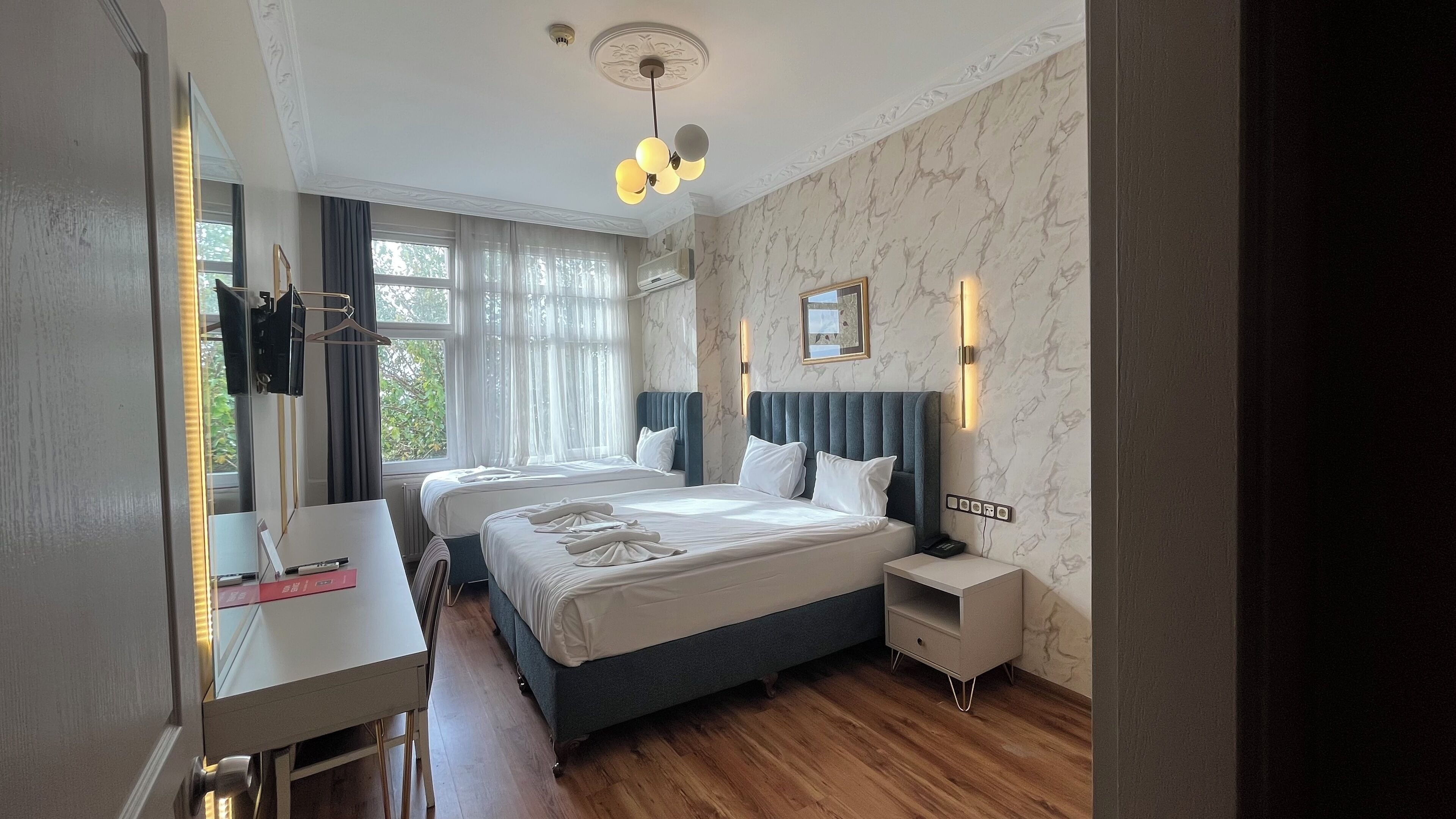 Deluxe Triple Room, Sea View | Premium bedding, pillowtop beds, minibar, in-room safe