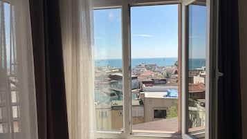 Deluxe Triple Room, Sea View | Premium bedding, pillowtop beds, minibar, in-room safe