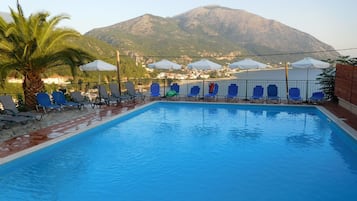 Seasonal outdoor pool, pool umbrellas, pool loungers
