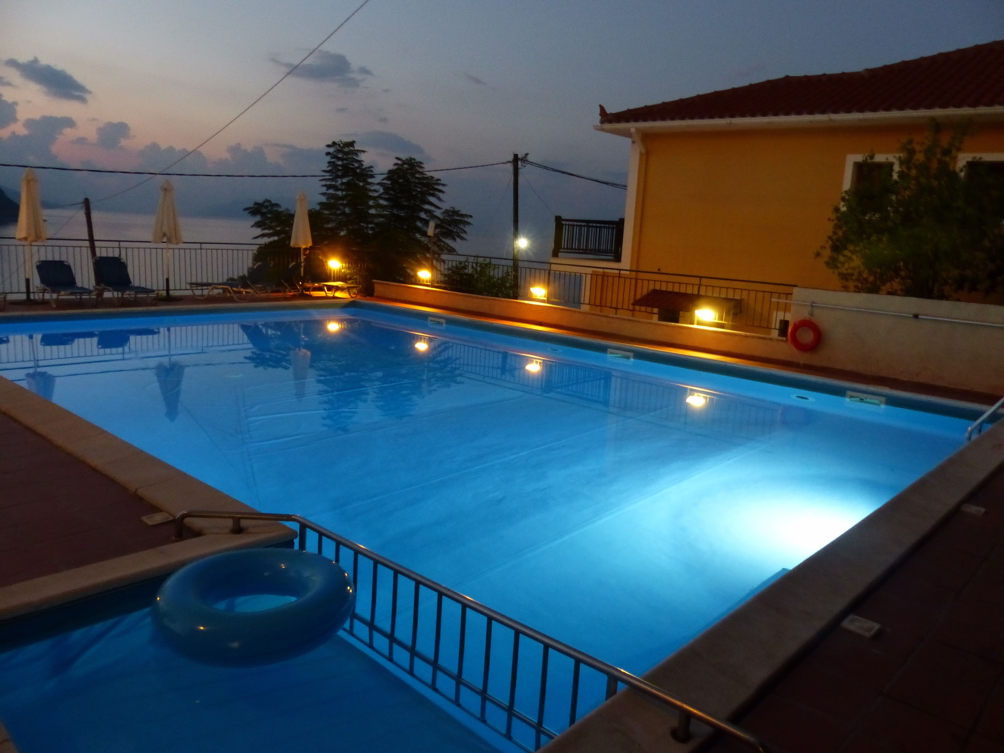 seasonal outdoor pool, pool umbrellas, pool loungers