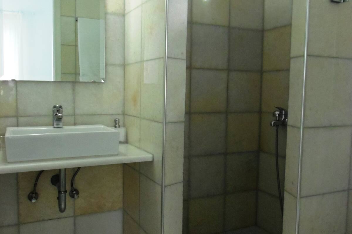 standard room | bathroom | shower, hair dryer, towels, soap