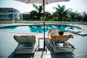 Outdoor pool, pool umbrellas, sun loungers