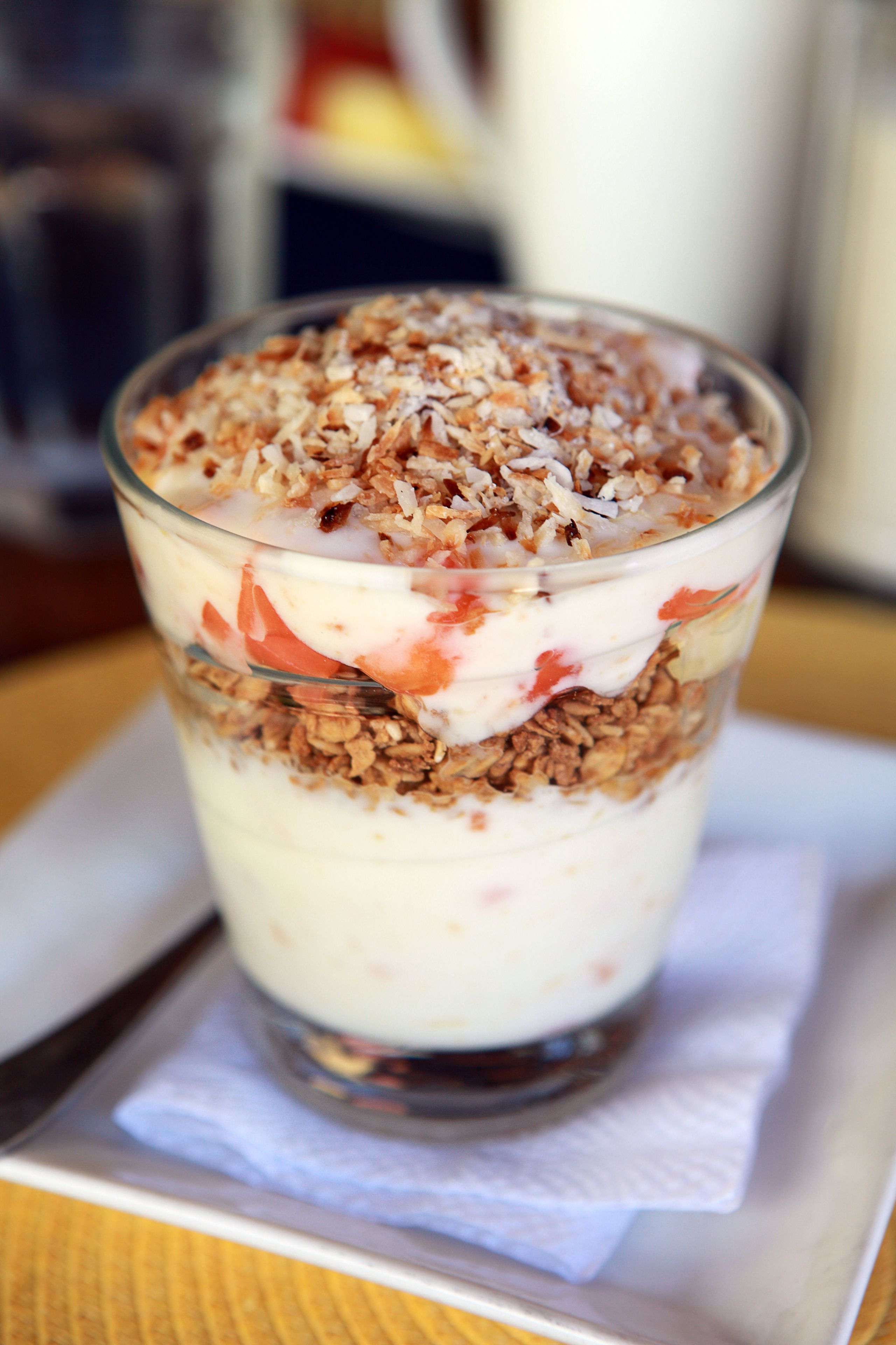 A layered dessert in a clear glass.