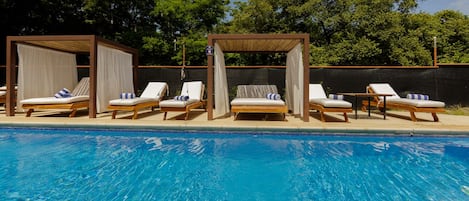 3 outdoor pools, open 7:00 AM to 7:00 PM, pool umbrellas