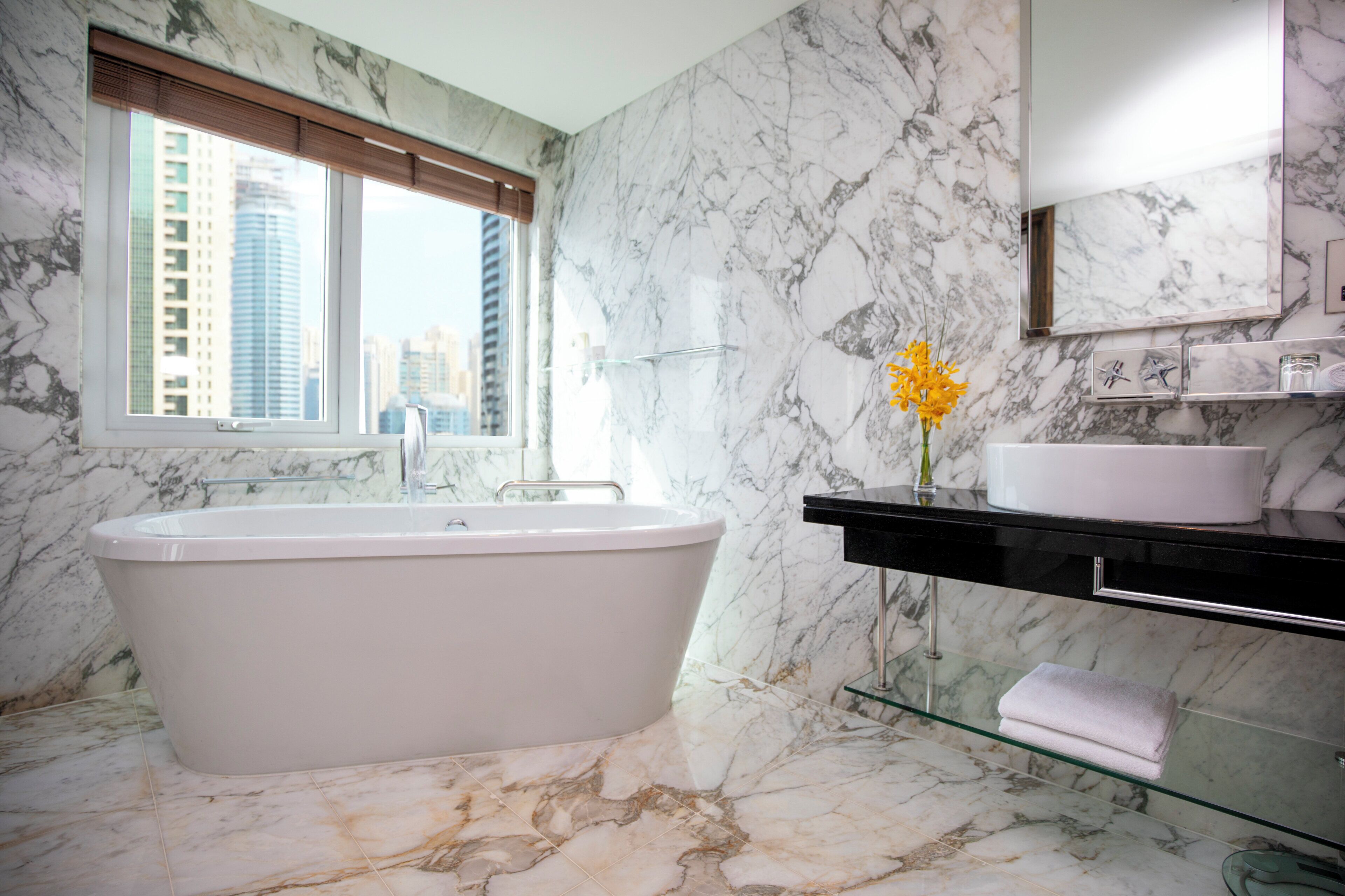 Separate bathtub and shower, rainfall showerhead, designer toiletries
