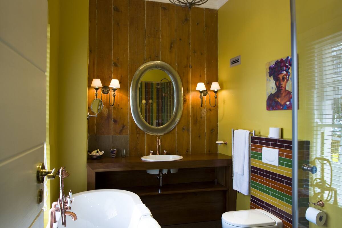separate bathtub and shower, deep-soaking bathtub, designer toiletries
