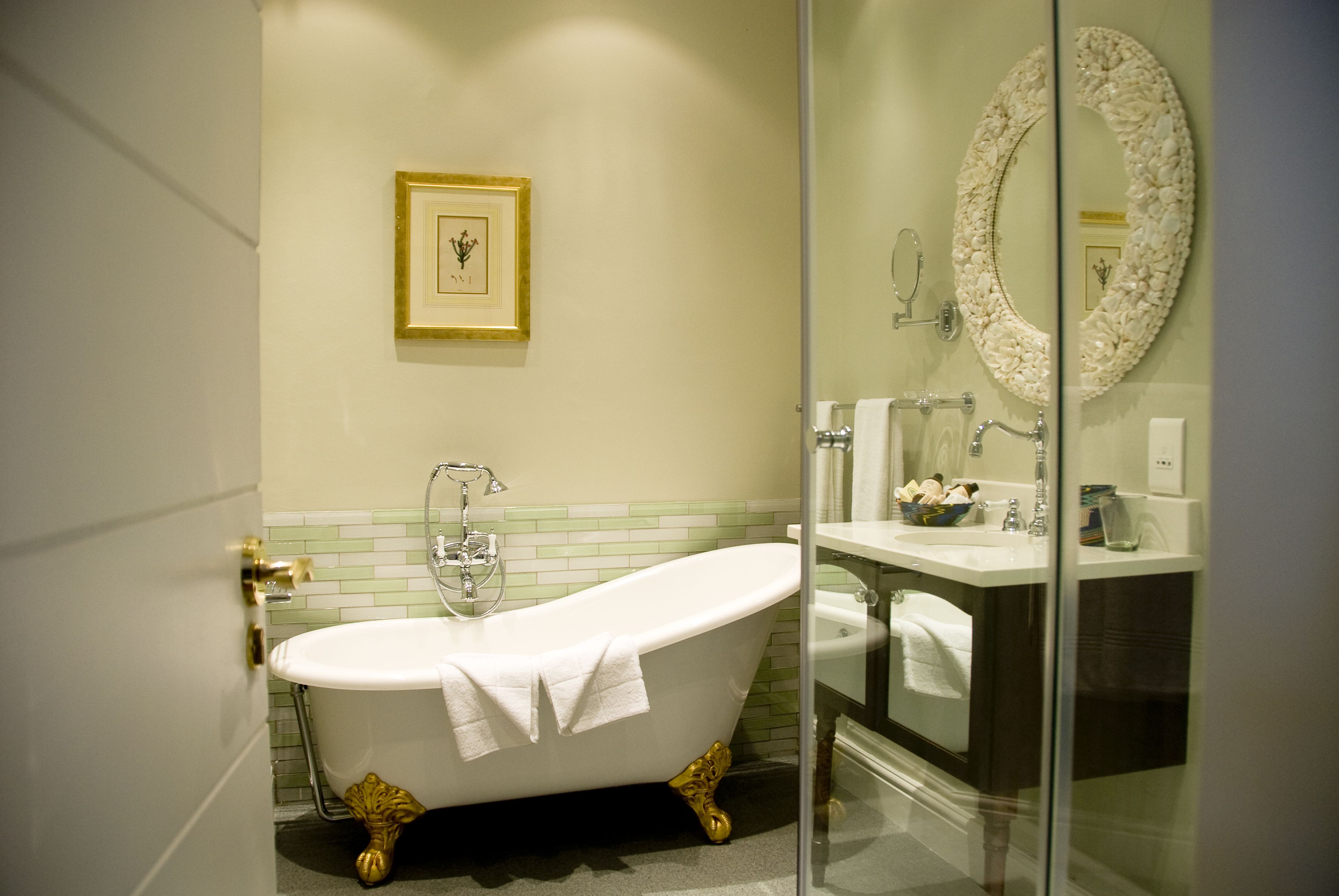 separate bathtub and shower, deep-soaking bathtub, designer toiletries