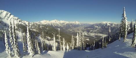 A snow-covered mountain landscape with a clear sky.