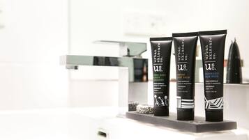 Three tubes of Urban Skincare products on a bathroom counter.