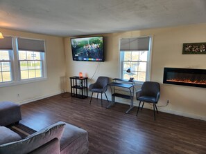 Deluxe Quadruple Room, 3 Bedrooms | Living area | 50-inch TV with digital channels - Jonathan Edwards Motel (Dennis Port)