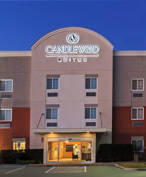 A hotel with a sign reading 'CANDLEWOOD SUITES' and a visible entrance. - Candlewood Suites Pearland by IHG (Pearland)