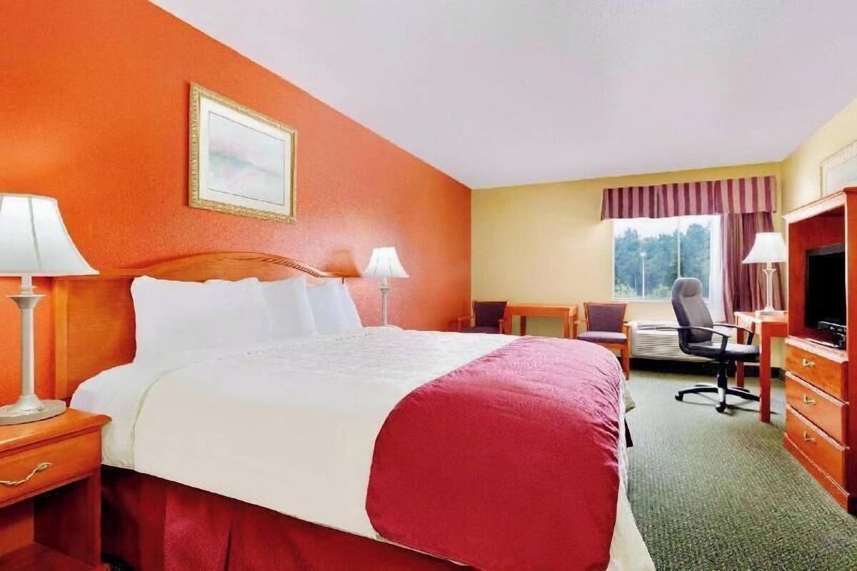 Desk, blackout drapes, iron/ironing board, rollaway beds