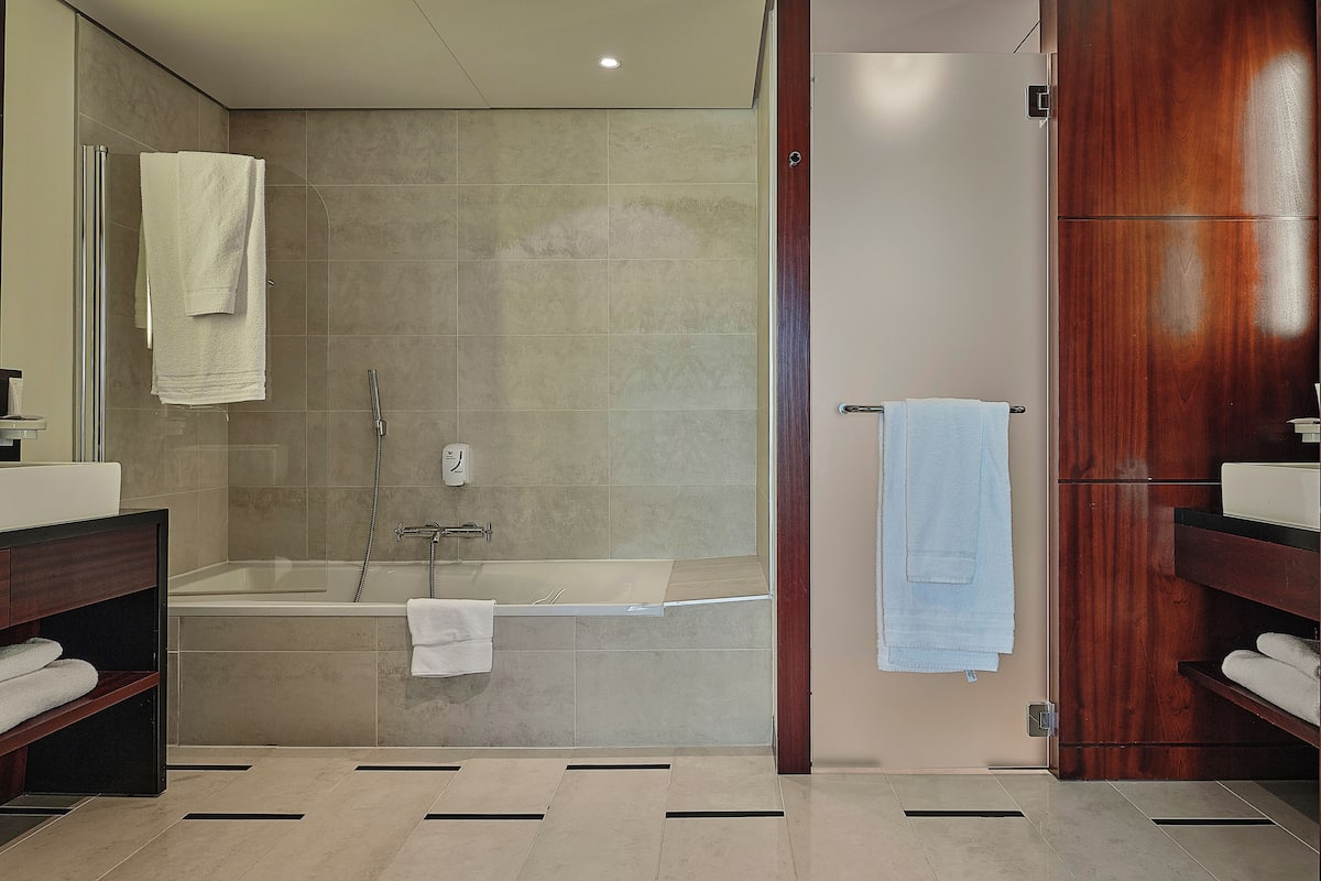 family room | bathroom | shower, free toiletries, hair dryer, towels