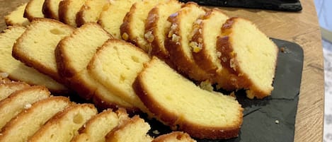 A display of various baked goods on a slate board.
