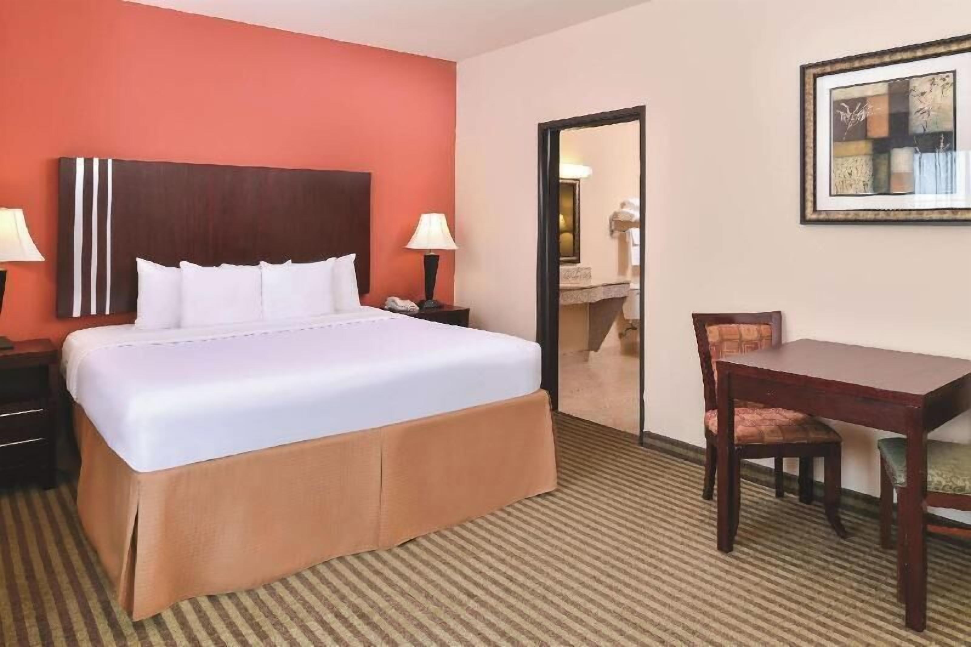 Premium bedding, desk, blackout curtains, iron/ironing board