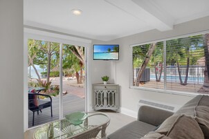 Suite, Bay View (Tropical) | Living area | Flat-screen TV