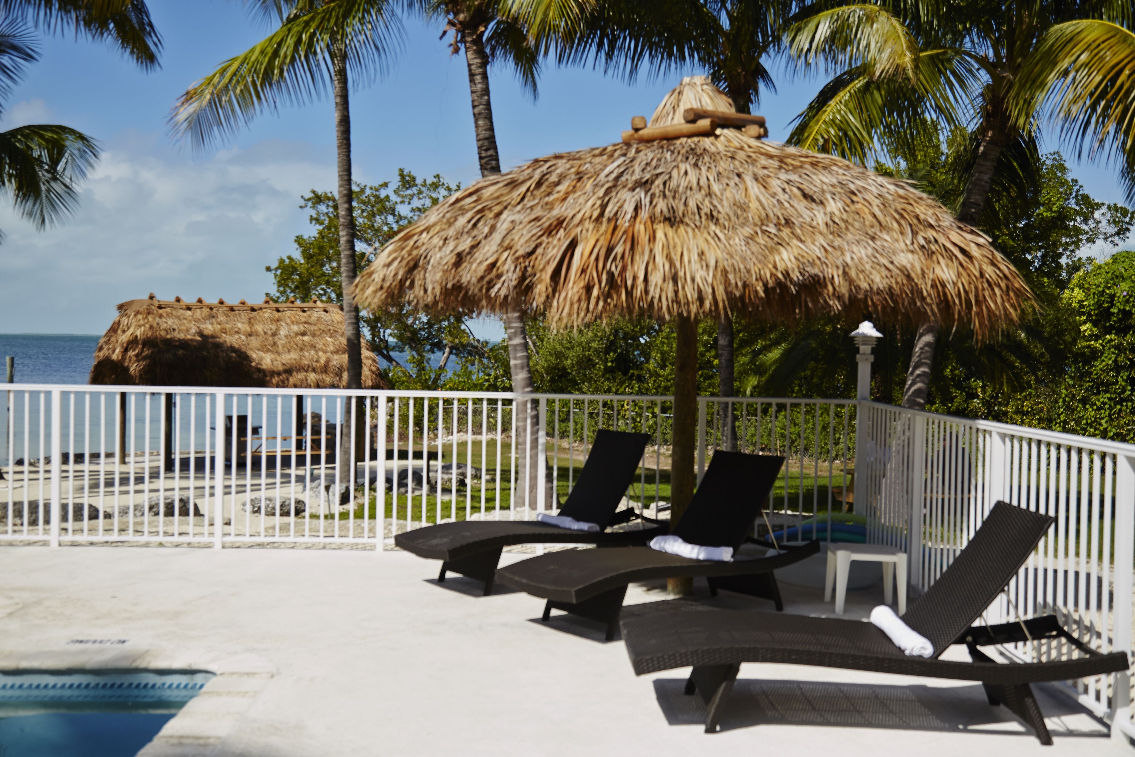 outdoor pool, open 8:00 am to 8:00 pm, pool loungers