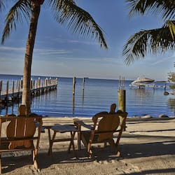 Private beach, white sand, beach towels, windsurfing