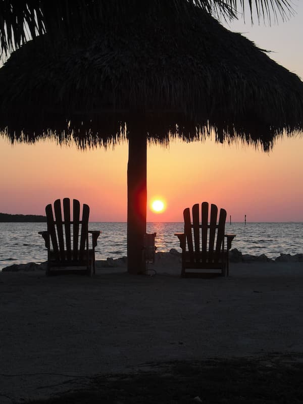 Private beach, white sand, beach towels, windsurfing