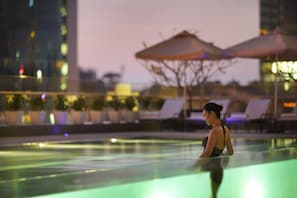 Outdoor pool, open 6:00 AM to 9:00 PM, pool loungers