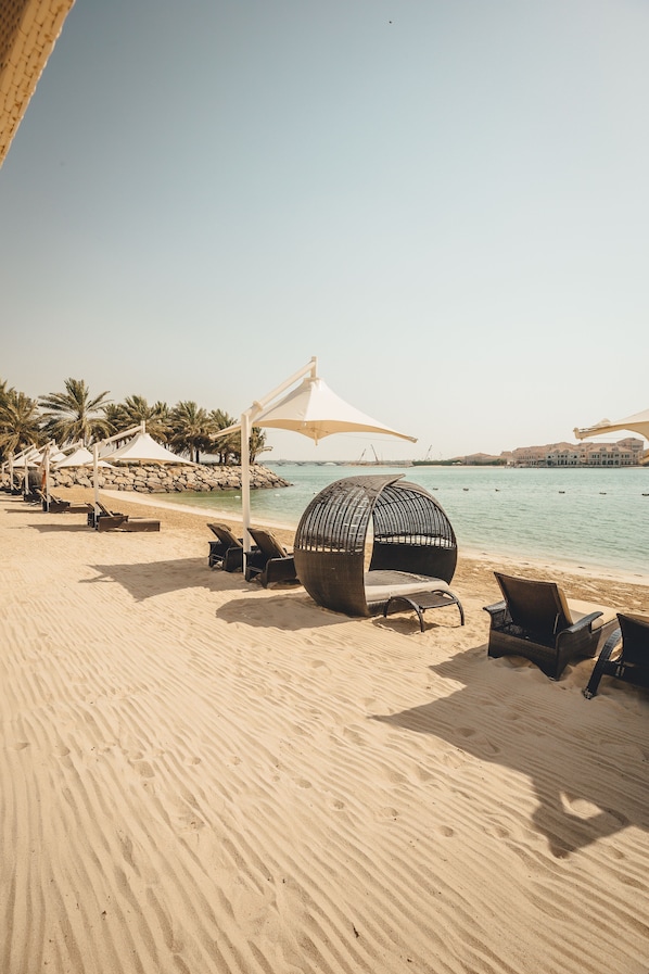 Private beach, beach umbrellas, beach towels