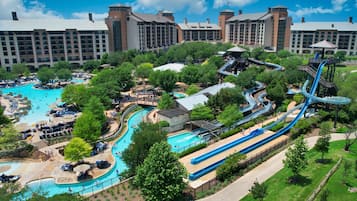 Experience the excitement of our hotel's water park, featuring a large pool area with water slides and lounge chairs.