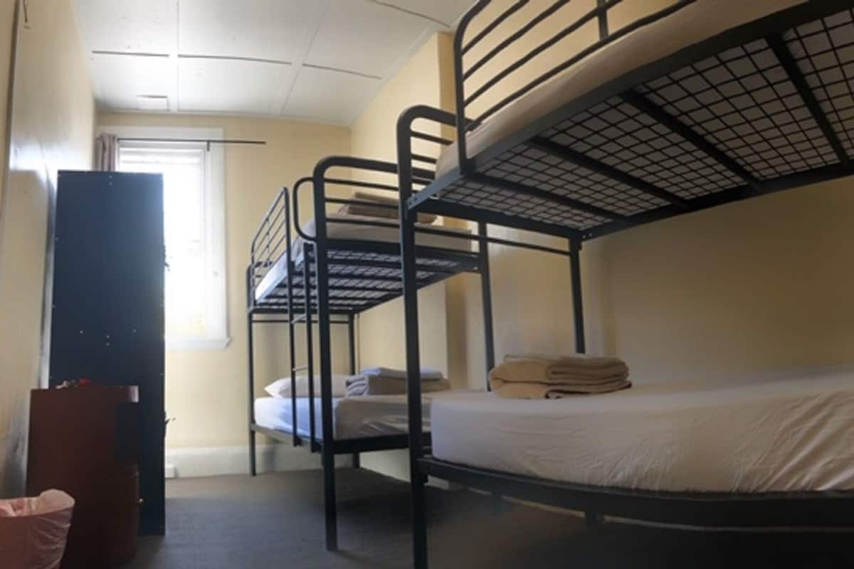 Bed in a Six Bed Female Dorm | Laptop workspace, blackout drapes, iron/ironing board, free WiFi