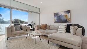 Three Bedroom Poolside Townhouse | Living area | 40-inch flat-screen TV with digital channels, TV, DVD player - Coast Resort Merimbula (Merimbula)