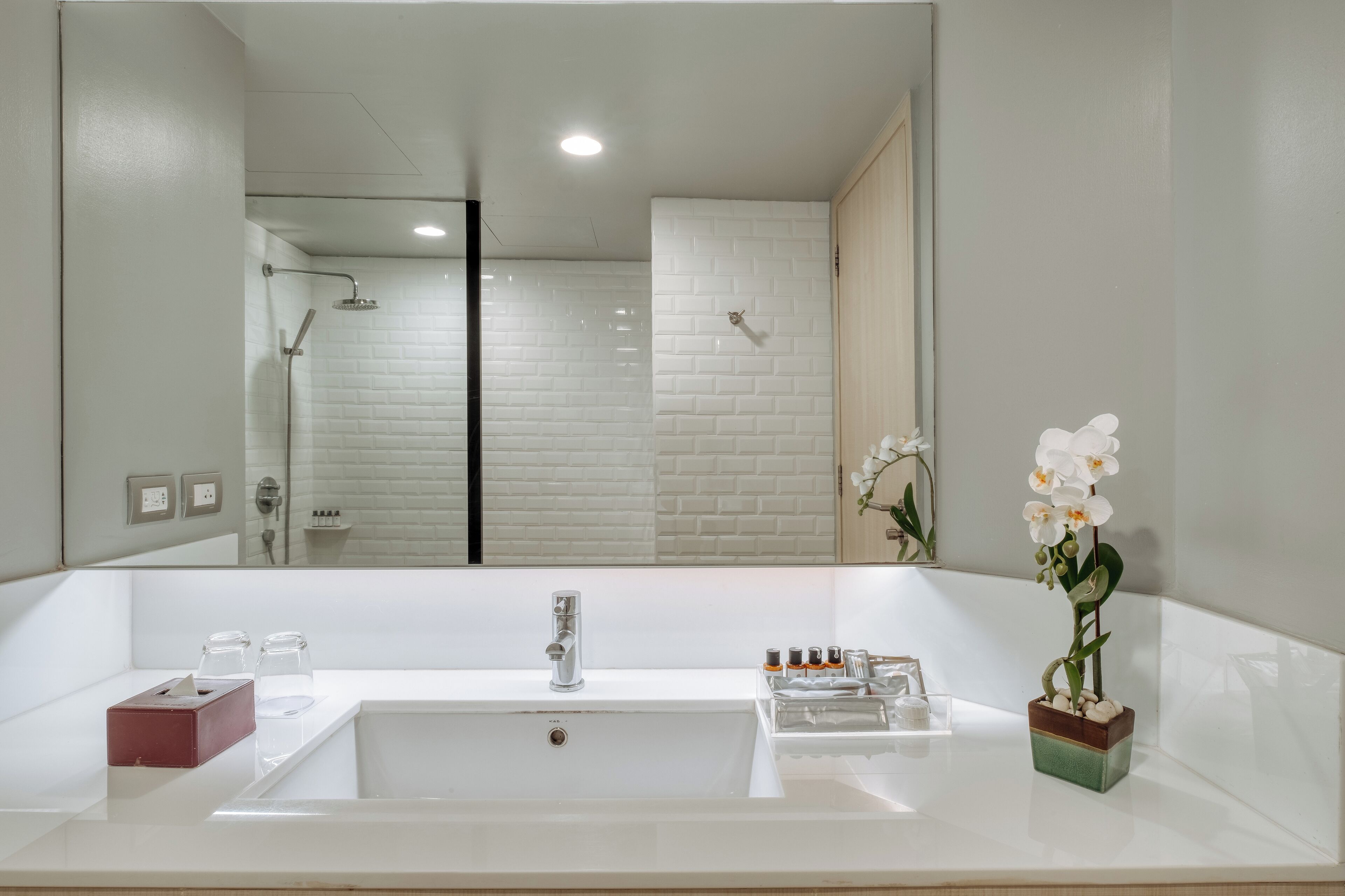 bathtub, eco-friendly toiletries, hair dryer, bathrobes