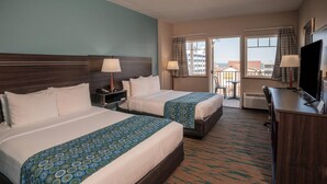 A hotel room with two beds, a desk, a TV, and a balcony with a view. - Gateway Hotel & Suites Ocean City, an Ascend Collection Hotel (Ocean City)