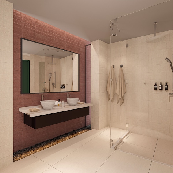Une salle de bain moderne avec un grand miroir, deux lavabos, une douche et un sol carrelé.