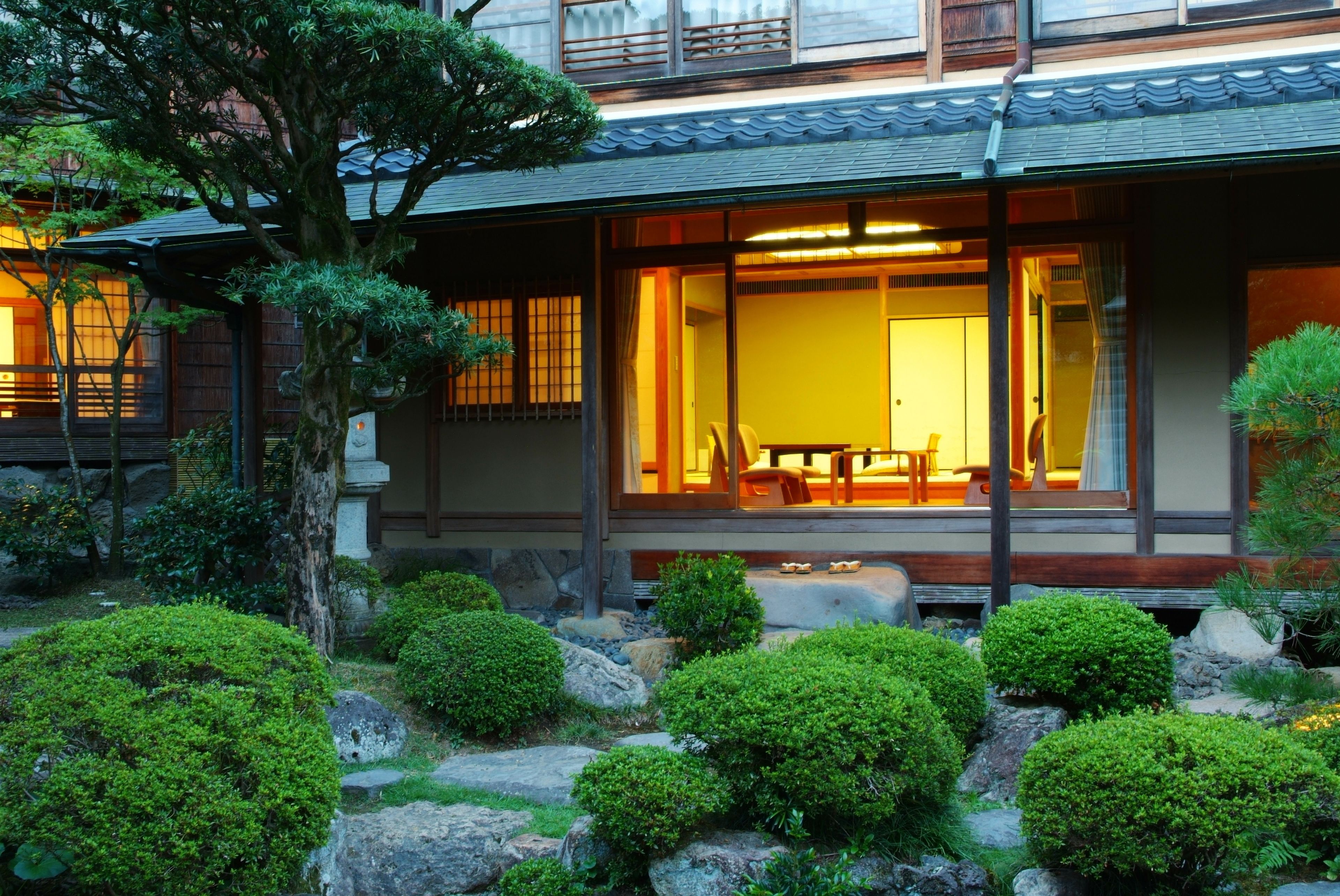 A traditional Japanese-style building with a wooden exterior and a large sliding door.