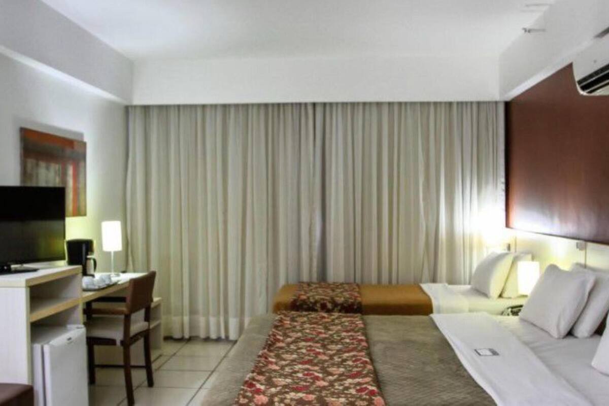 Deluxe Room, Multiple Beds, Non Smoking | Minibar, in-room safe, laptop workspace, iron/ironing board