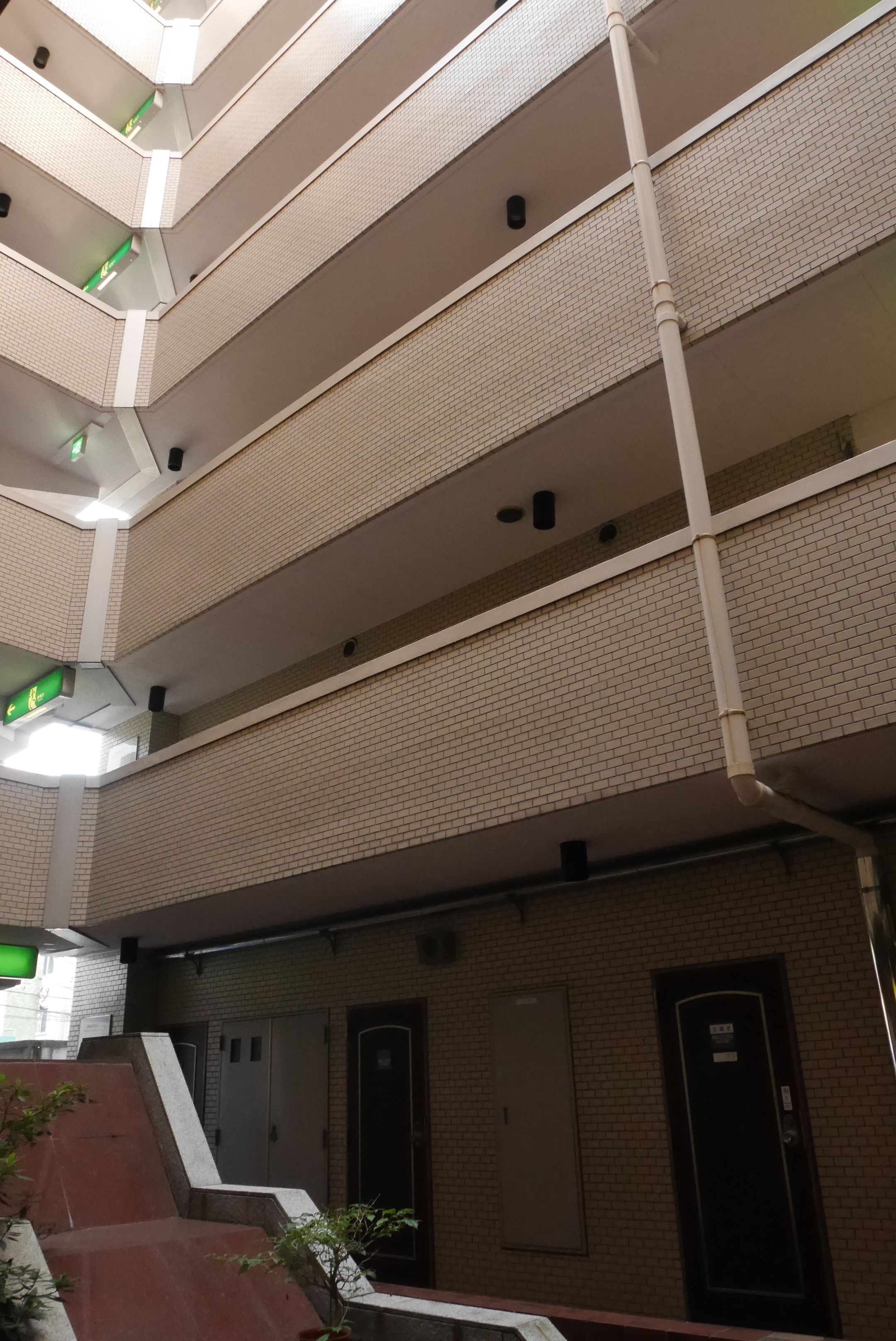 A multi-level building with a brick exterior and a tiled interior.