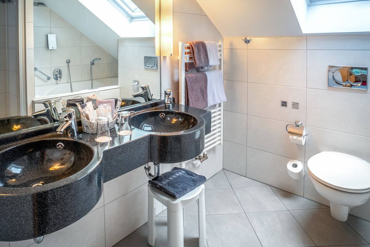 suite | bathroom | free toiletries, hair dryer, slippers, towels