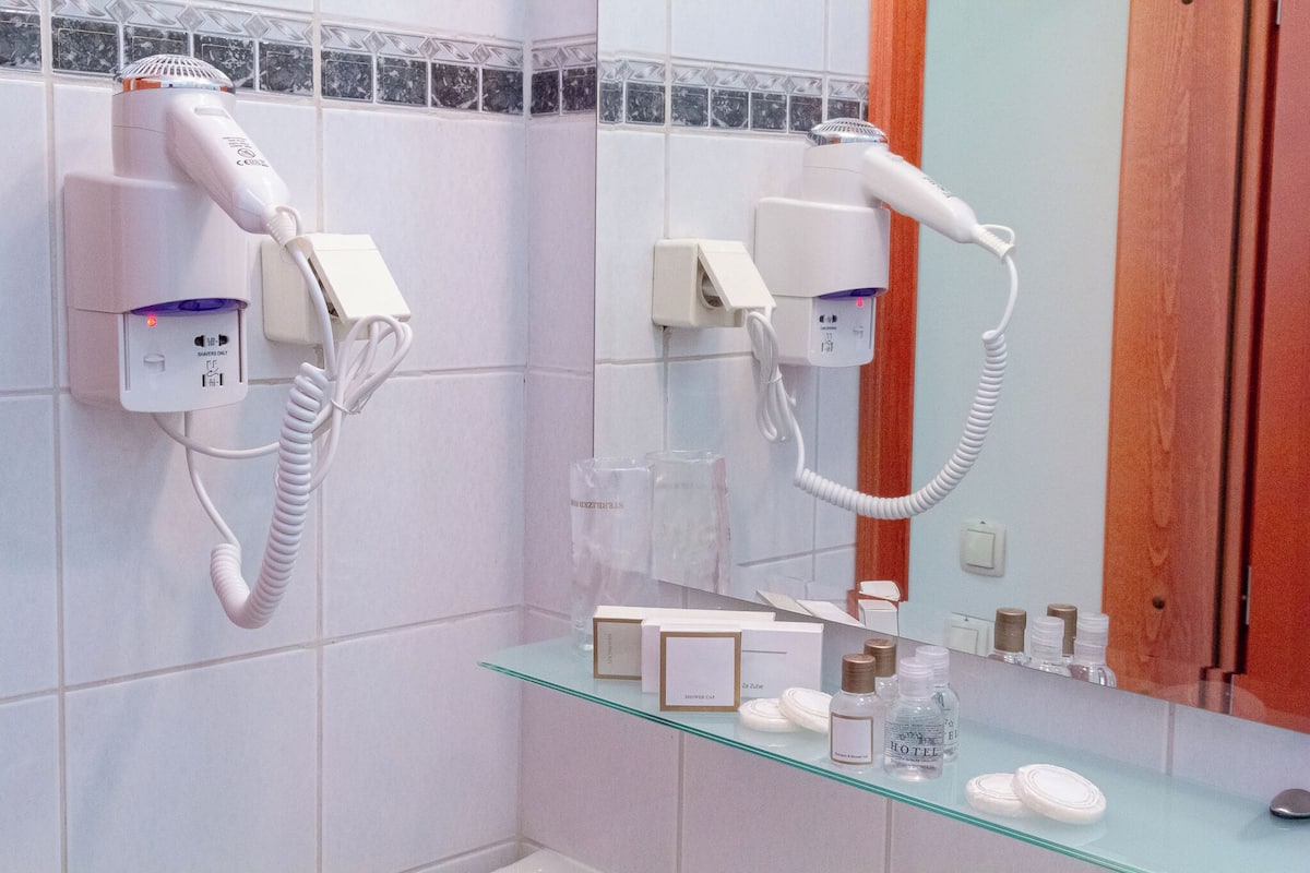 shower, hair dryer, bathrobes, slippers
