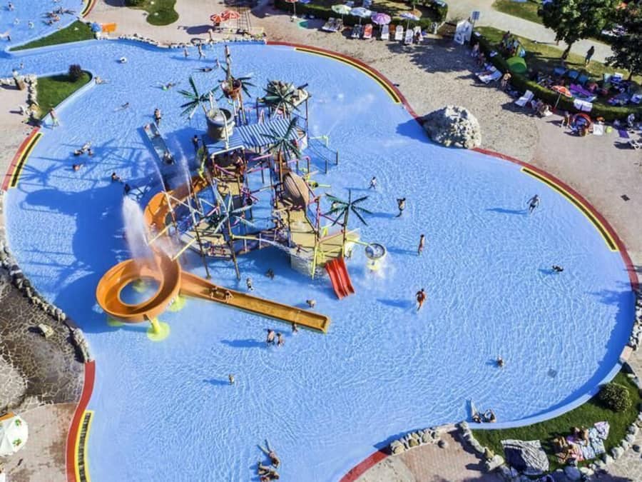 Indoor pool, outdoor pool, open 9 AM to 9 PM, pool umbrellas