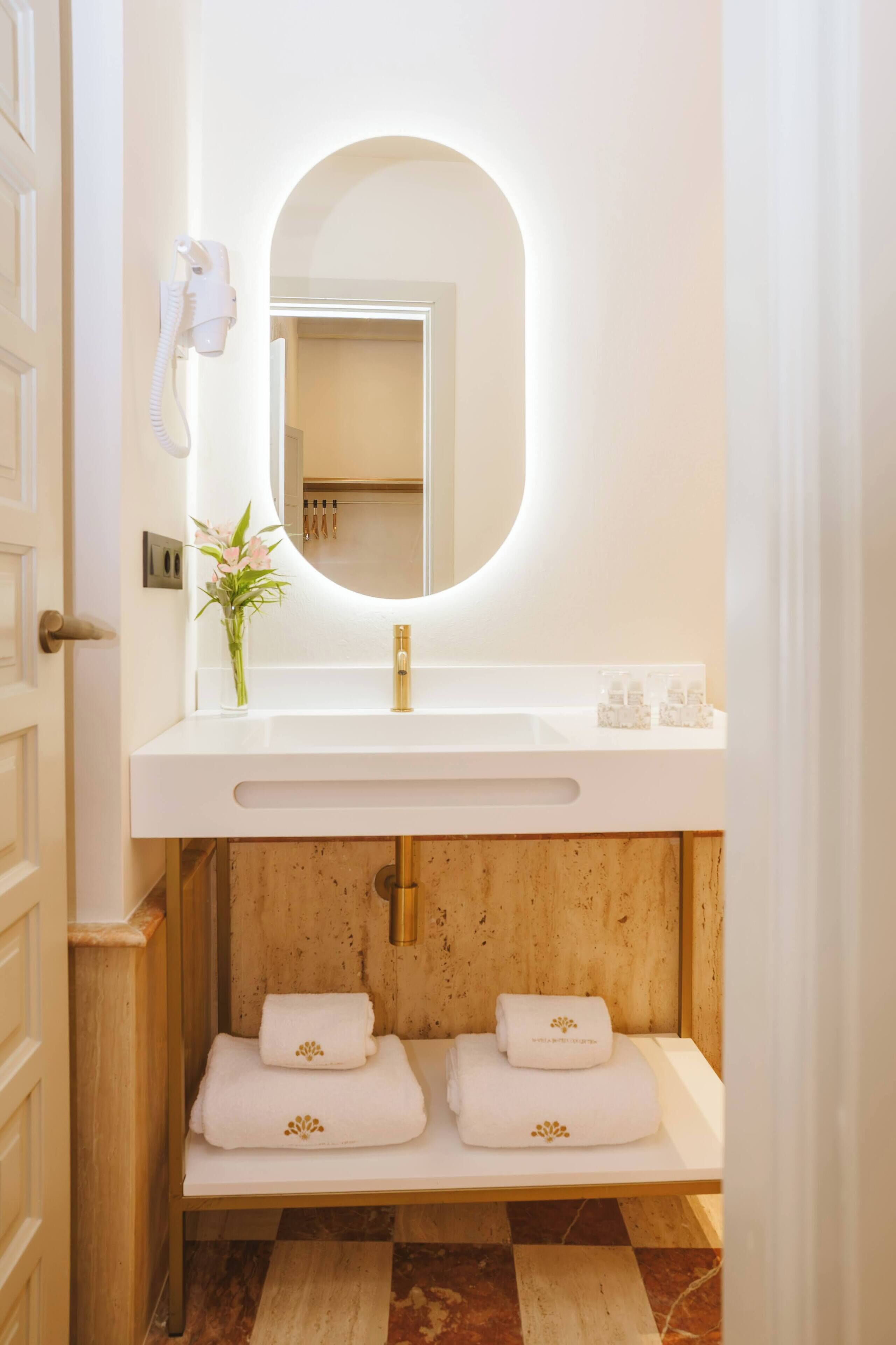 bathtub, hair dryer, bathrobes, slippers