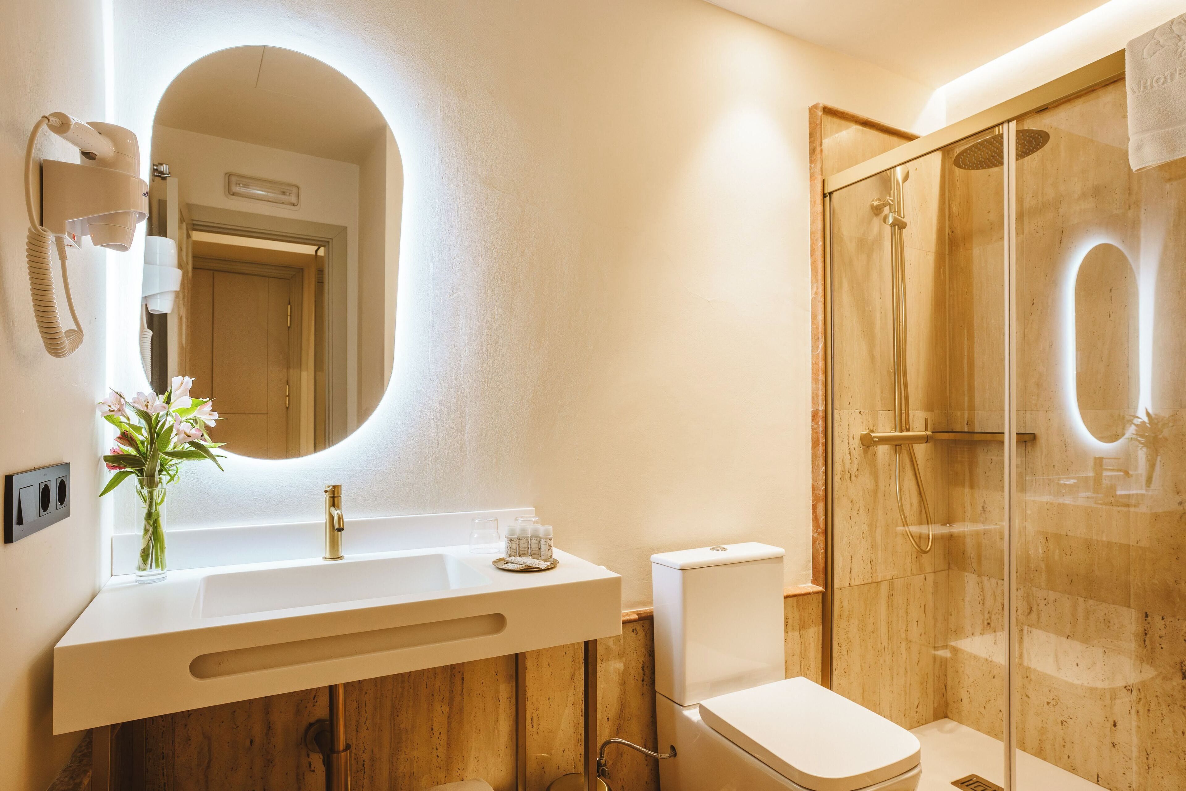 bathtub, hair dryer, bathrobes, slippers