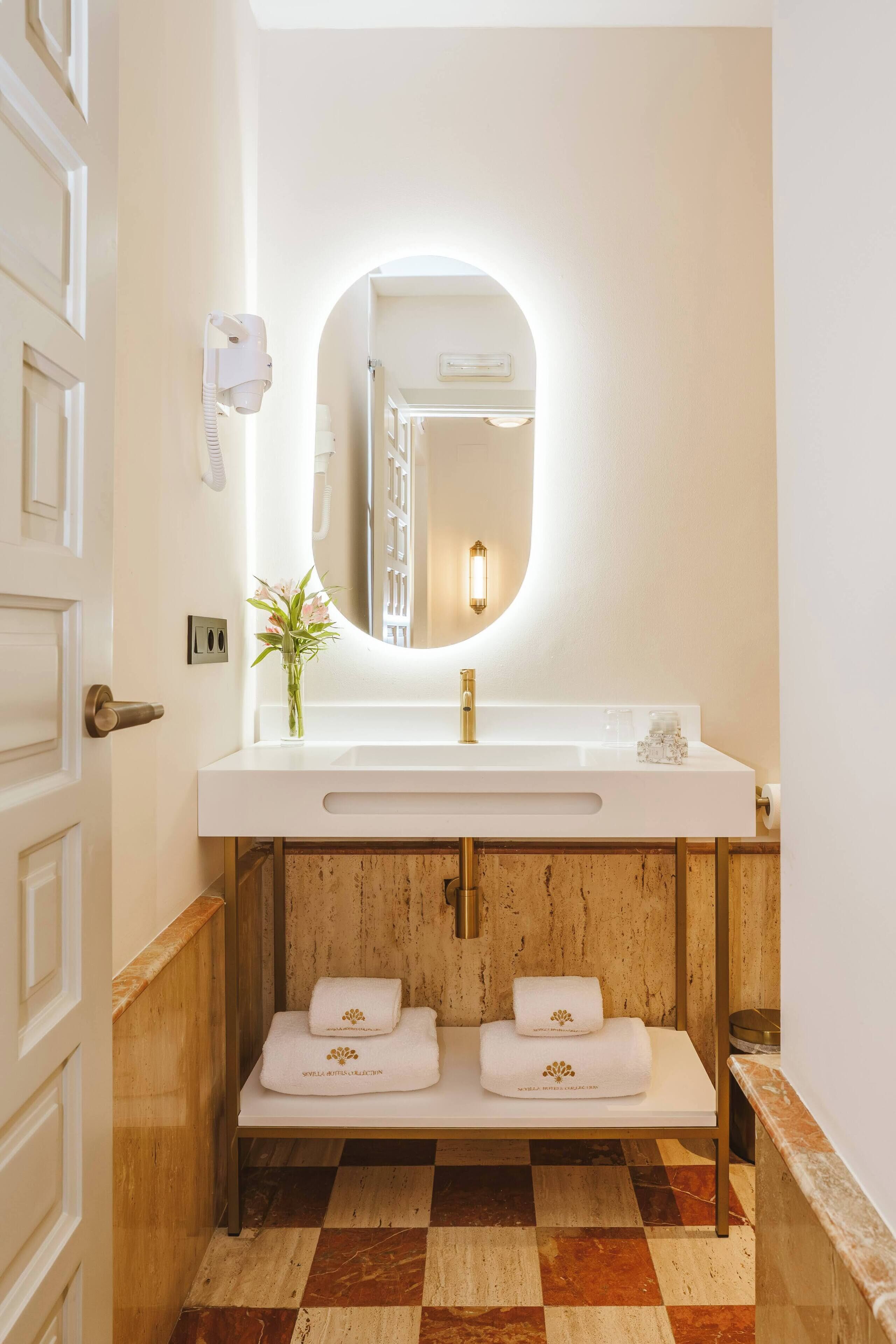 bathtub, hair dryer, bathrobes, slippers