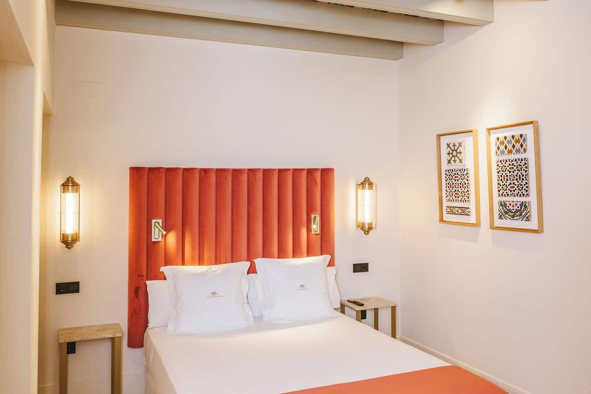 Double Room (Interior) | Minibar, in-room safe, individually decorated, individually furnished