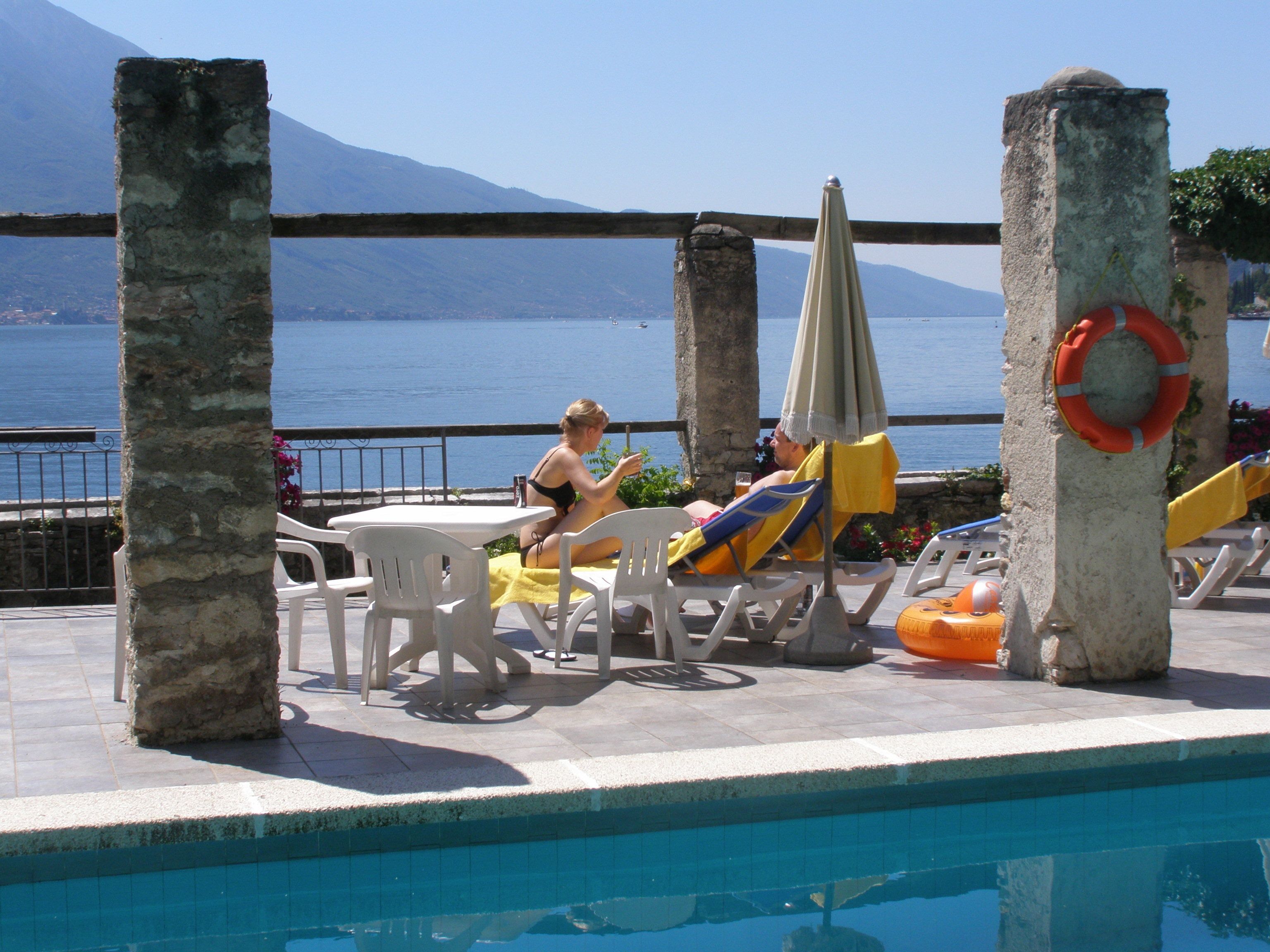 seasonal outdoor pool, pool umbrellas, pool loungers