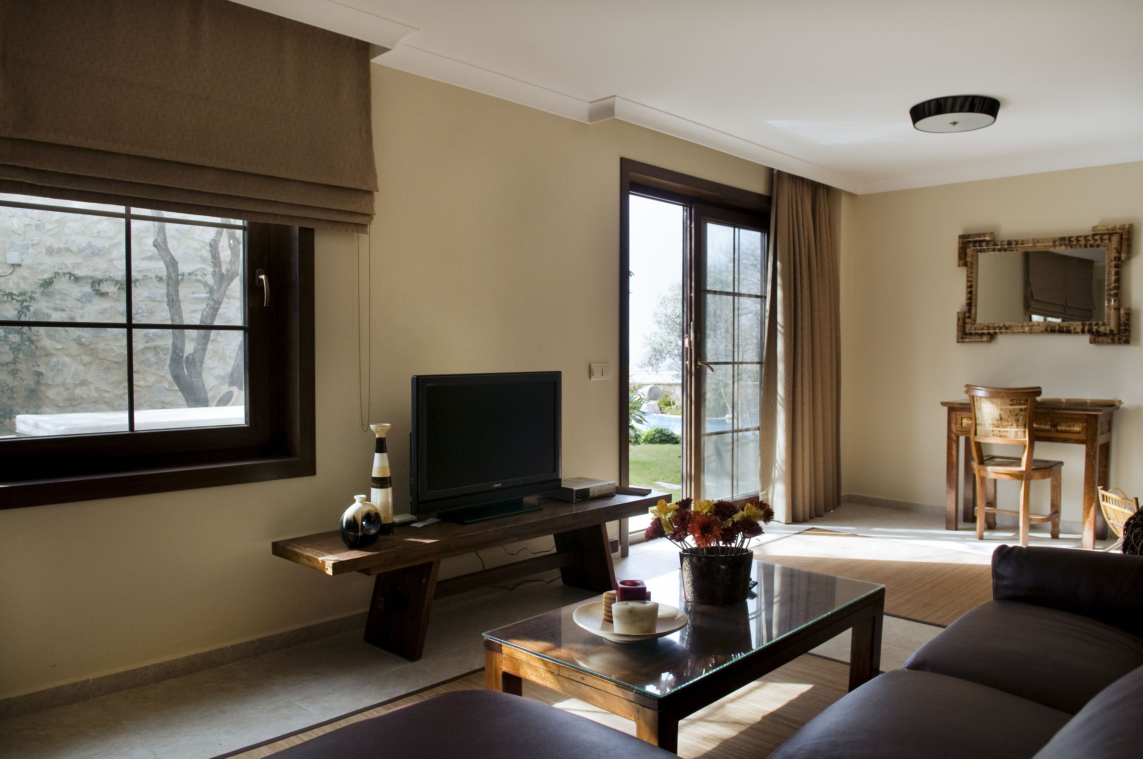 garden comfort suite with patio & garden view | living area | 40-inch led tv with satellite channels, tv, netflix