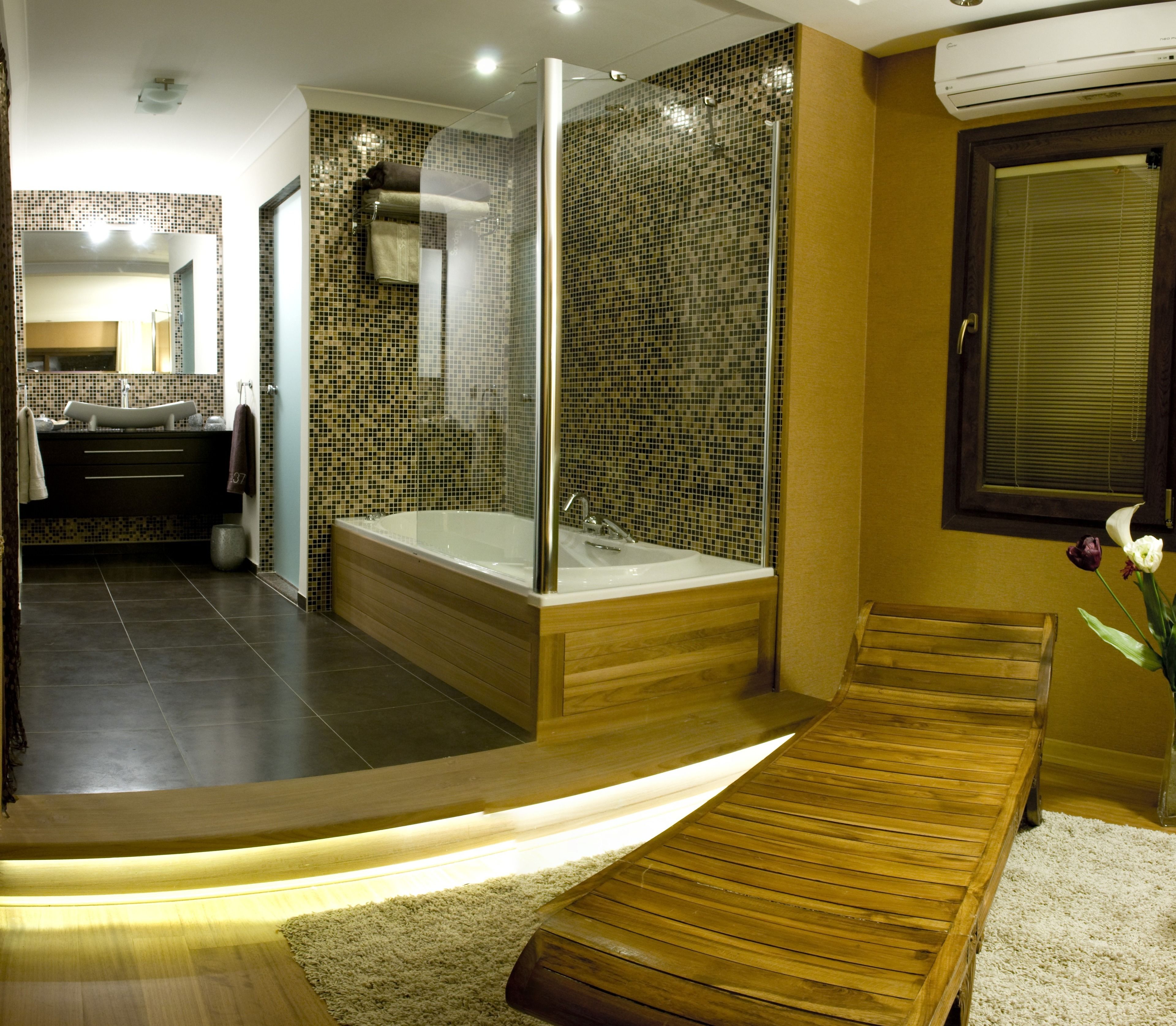 grand deluxe suite with hot tub, fireplace, terrace & sea view | bathroom | free toiletries, hair dryer, slippers, towels