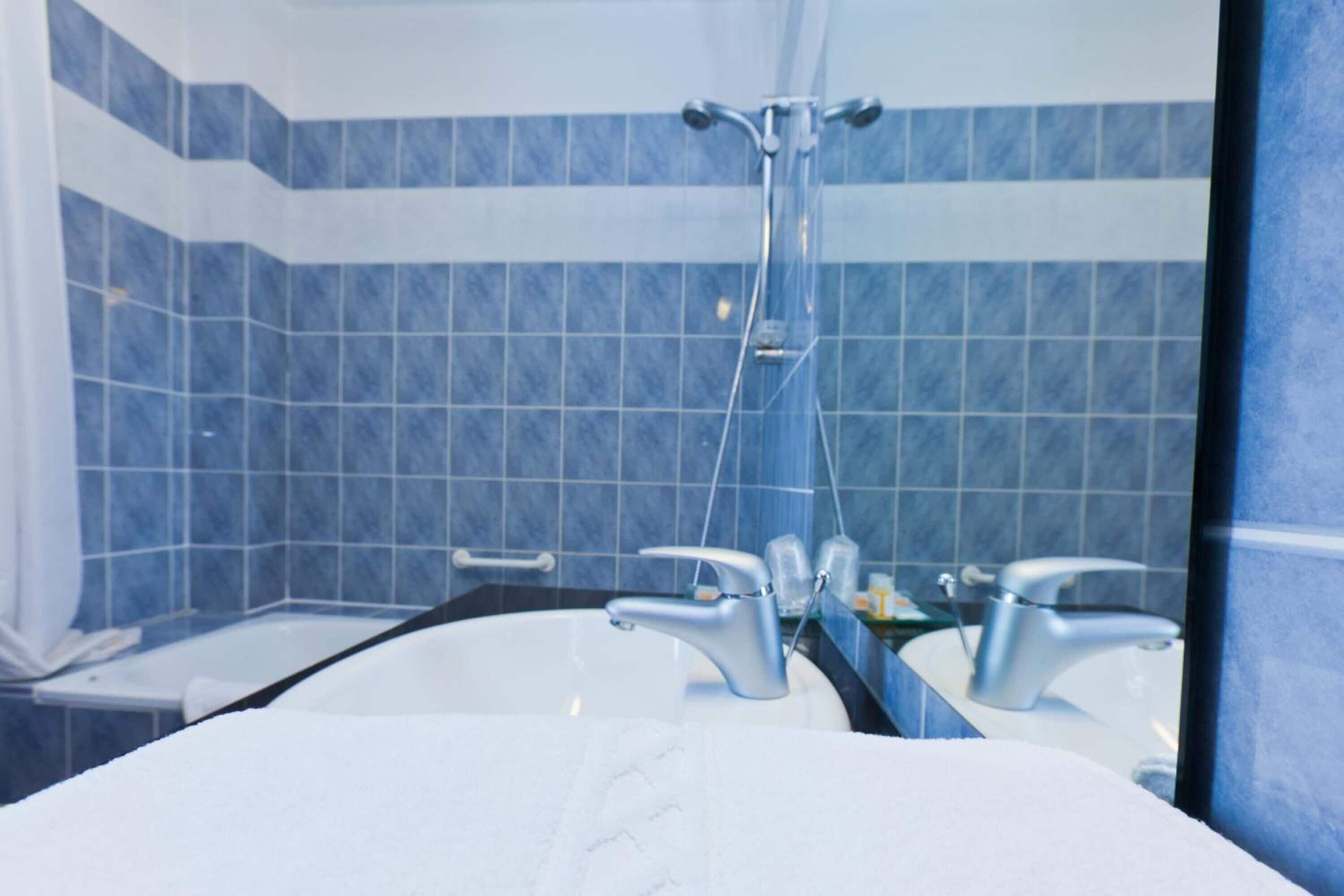 deep-soaking bathtub, hair dryer, towels