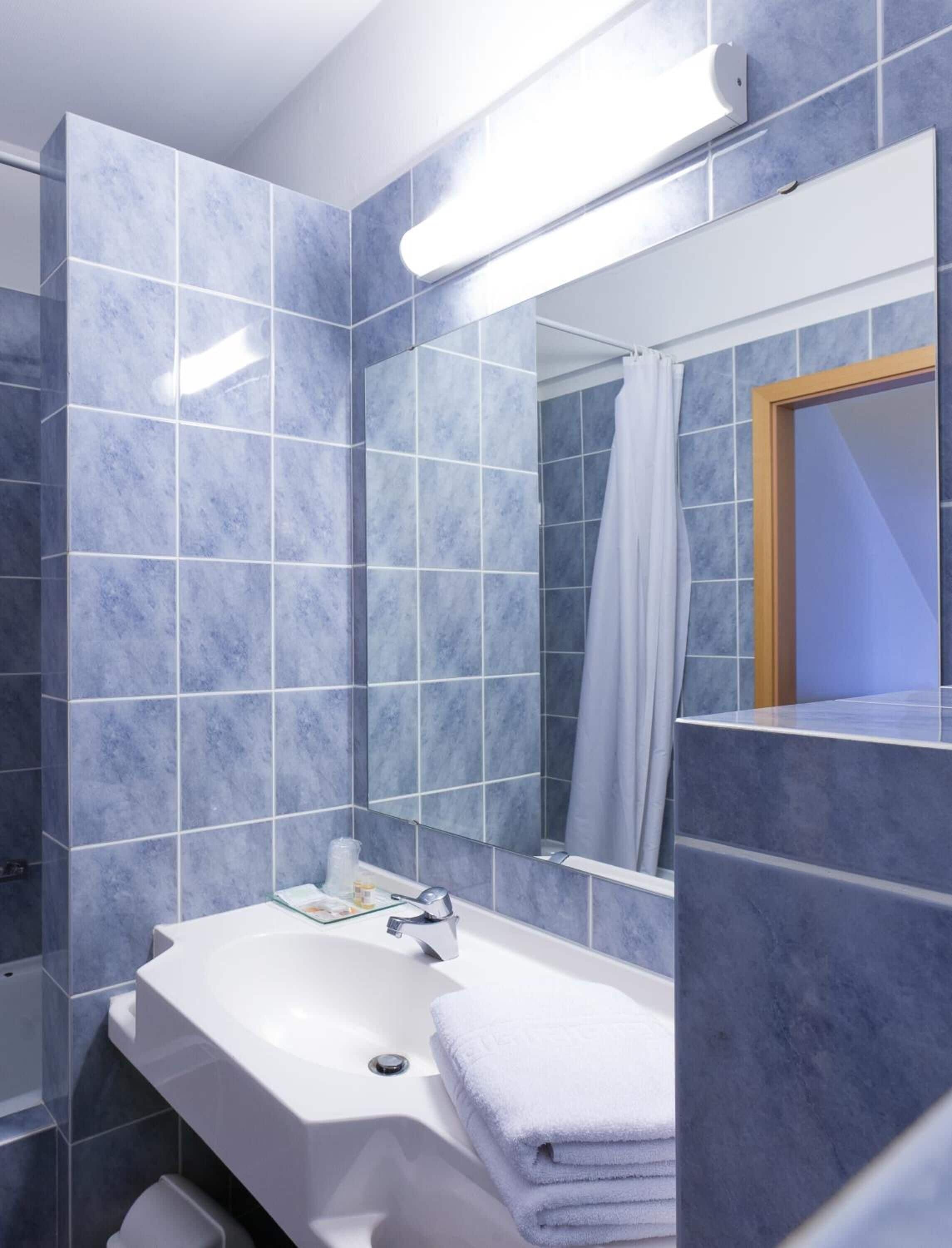 standard double room | bathroom | deep-soaking bathtub, hair dryer, towels