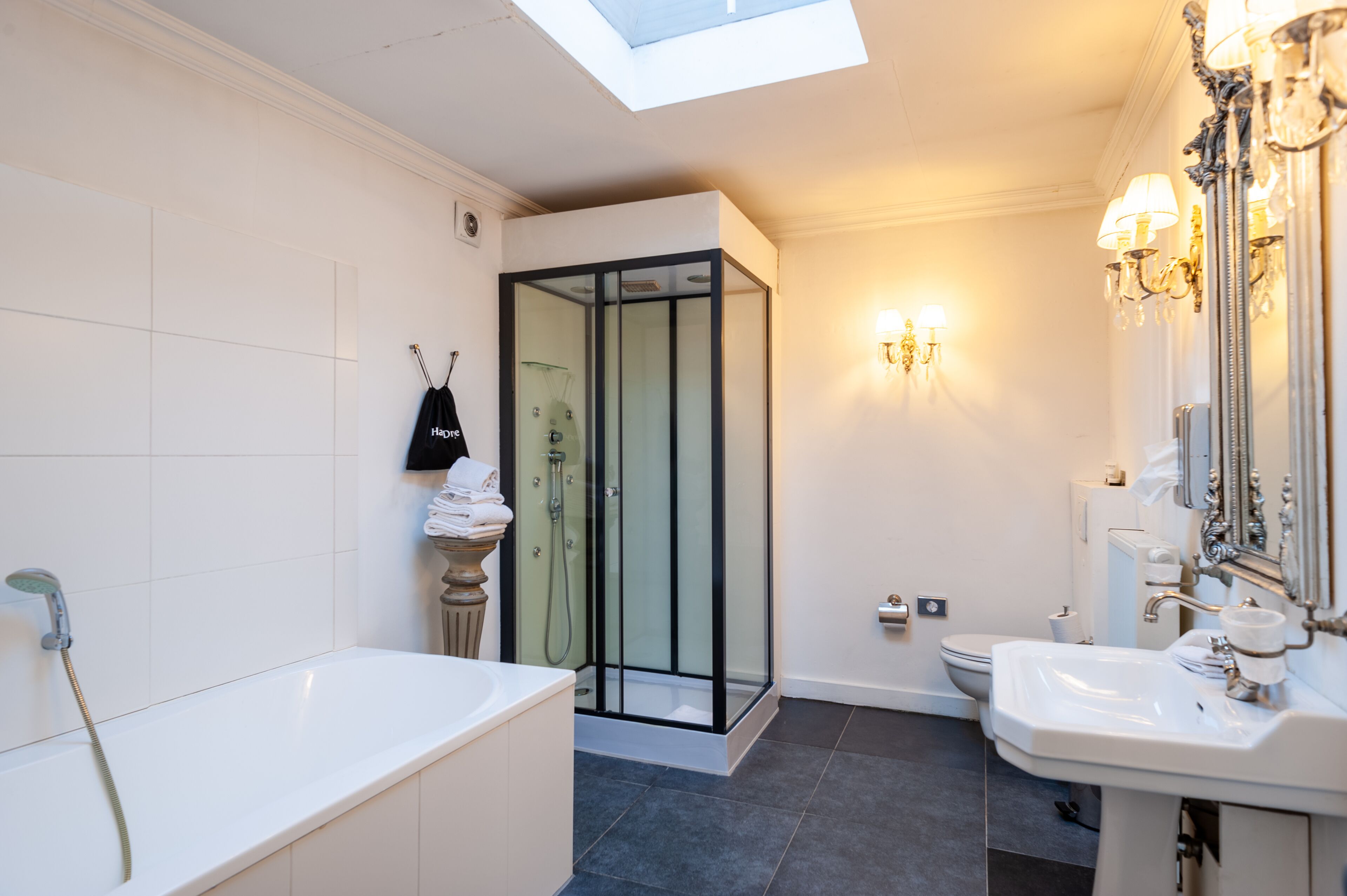 superior double room | bathroom | shower, hair dryer, slippers, towels