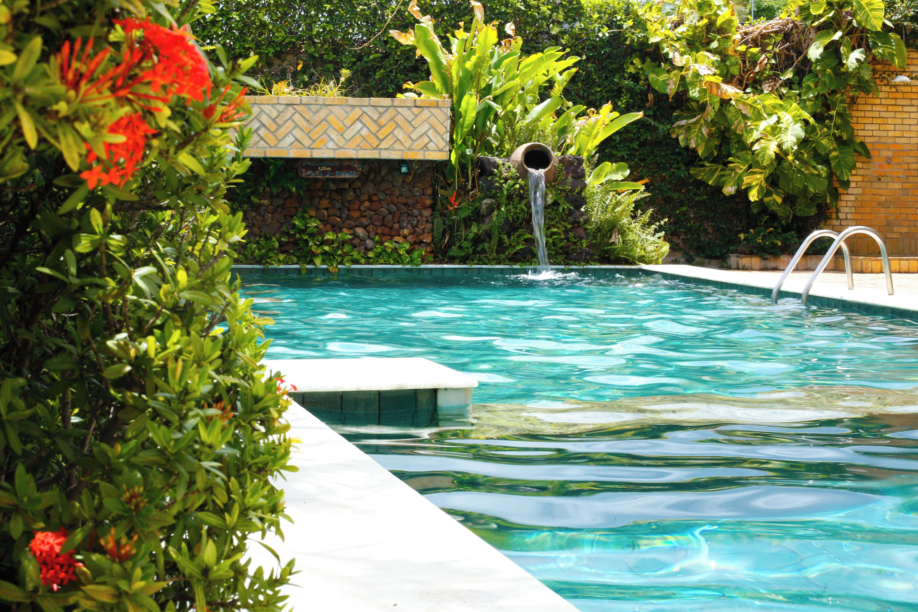 outdoor pool, open 8:00 am to 10:00 pm, pool umbrellas, pool loungers